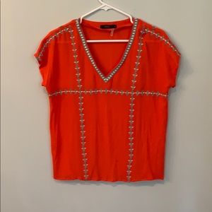 Orange blouse with aqua and white embroidery